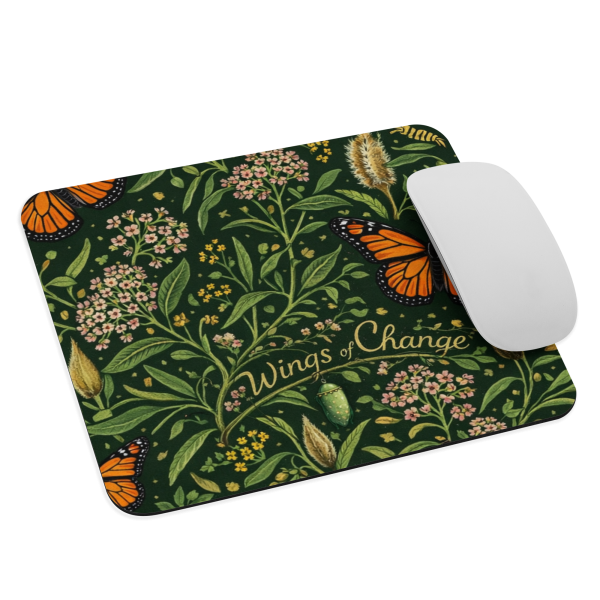 Monarch butterfly and milkweed botanical mouse pad with “Wings of Change” text, featuring orange butterflies and green floral pattern on a non-slip rubber base